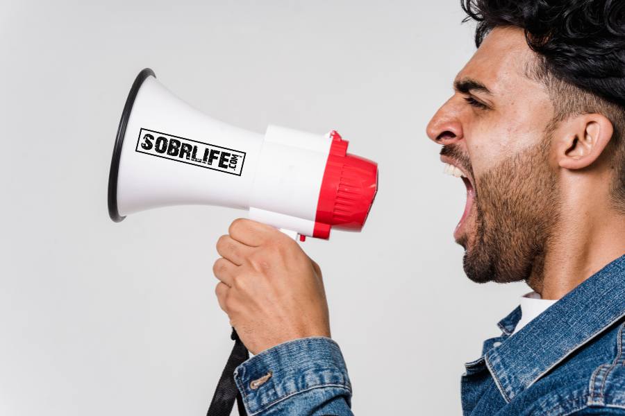 Man with SOBRLIFE.com megaphone embodies the Recover Out Loud Movement